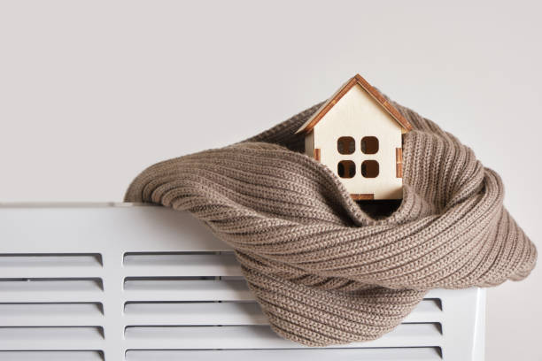 Scarf and a small wooden model of the house 