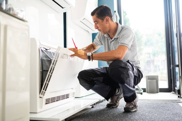 technician doing an air conditioner installation